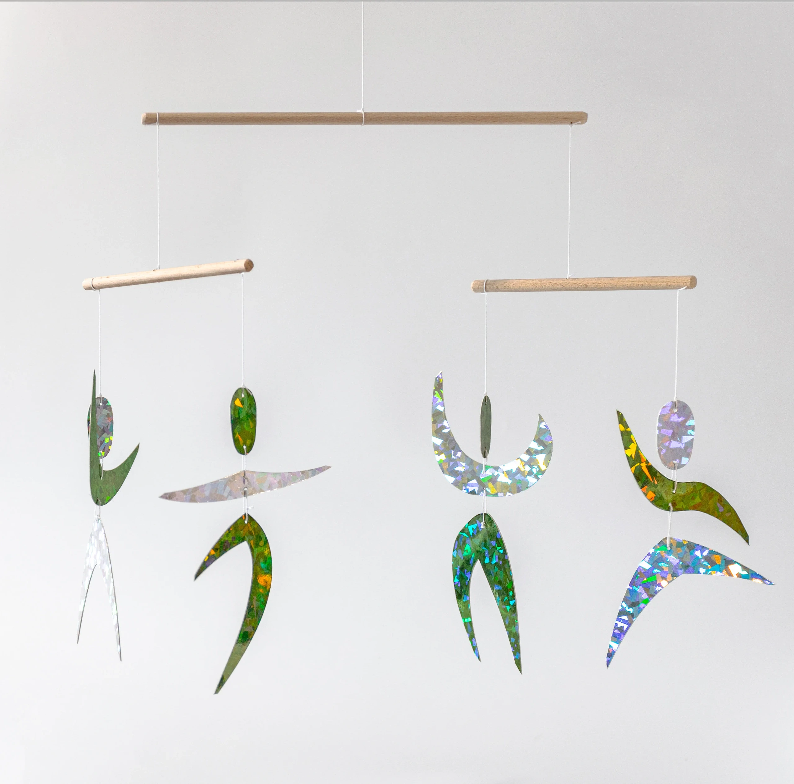 Montessori Dancers mobile made of metallic paper figures in two colors