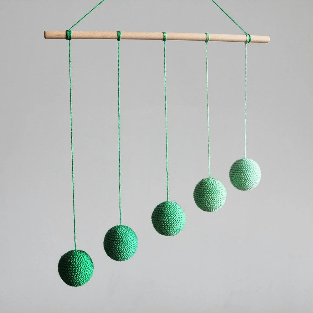Montessori Gobbi mobile with five thread-wrapped spheres graded from light to dark
