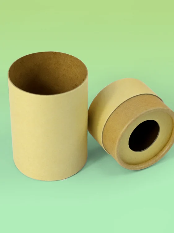 A round kraft-paper tube beside its lid, which has a circular hole in the middle, on a pale green background