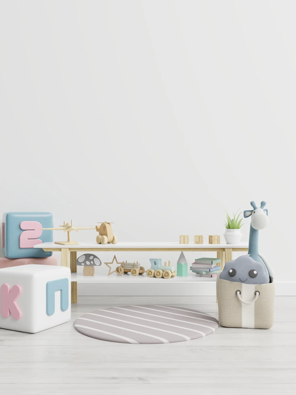 A low white shelf with a few wooden toys and books, a round striped rug and a basket holding a plush giraffe